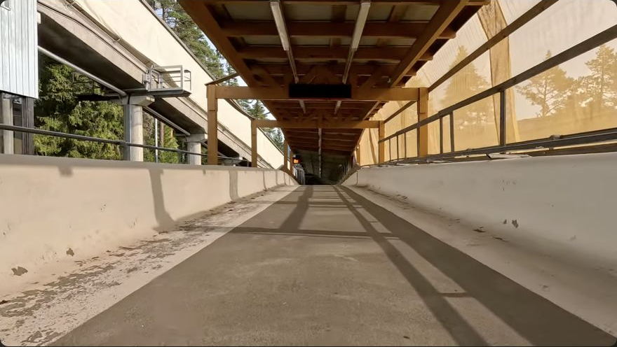 Recovered YouTube inspection screenshot showing the covered straight at the beginning of the wheeled bobsled run